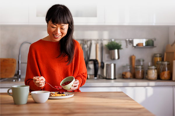 Learn more about Nutrition DNA test Young woman preparing healthy breakfast after doing a nutrition DNA test